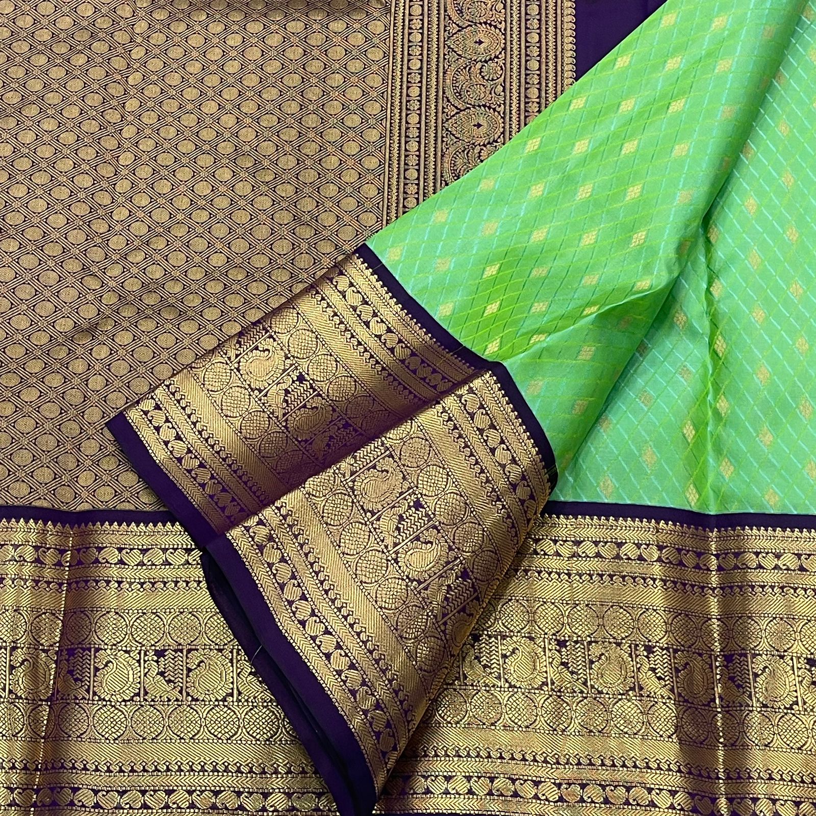 Rani Pink Kanjivaram Silk Saree with a Contrast Purple Zari Border.